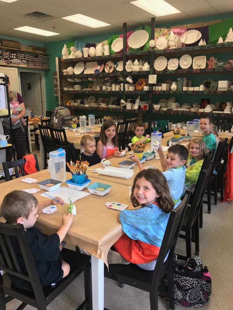 Our favorite customers: kids! They're having tons of fun painting their dinosaurs!